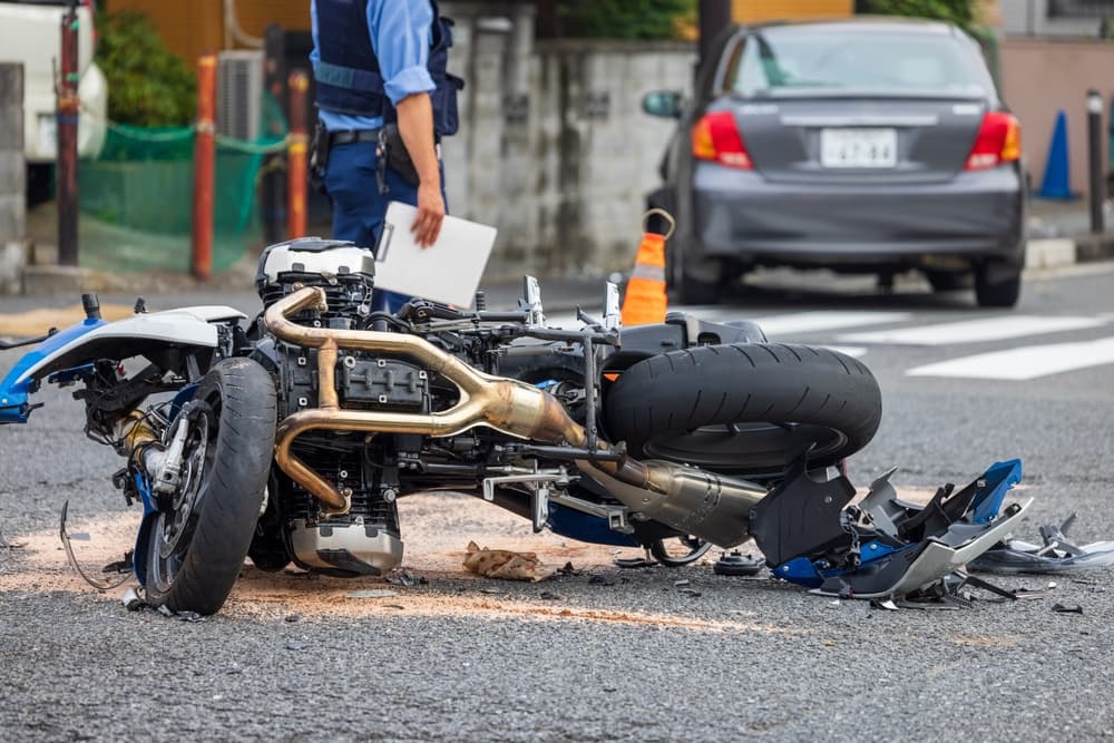 A motorcycle collided with a passenger vehicle at an intersection.