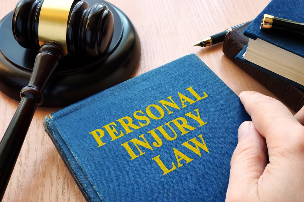 Personal injury law concept featuring a gavel resting on a desk.