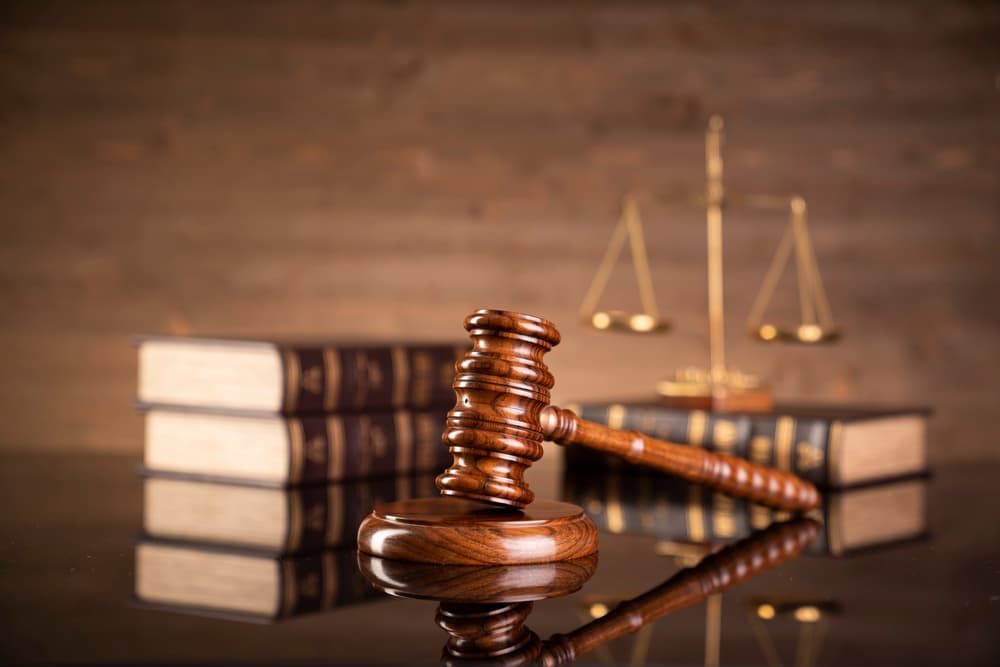 Lawyer’s office with a judge’s gavel resting on a glossy table.