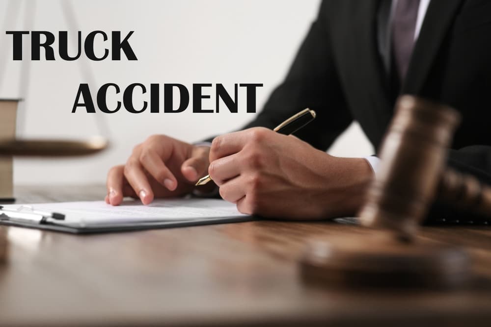 Truck accident law: A judge reviewing case materials at a wooden table, close-up view.