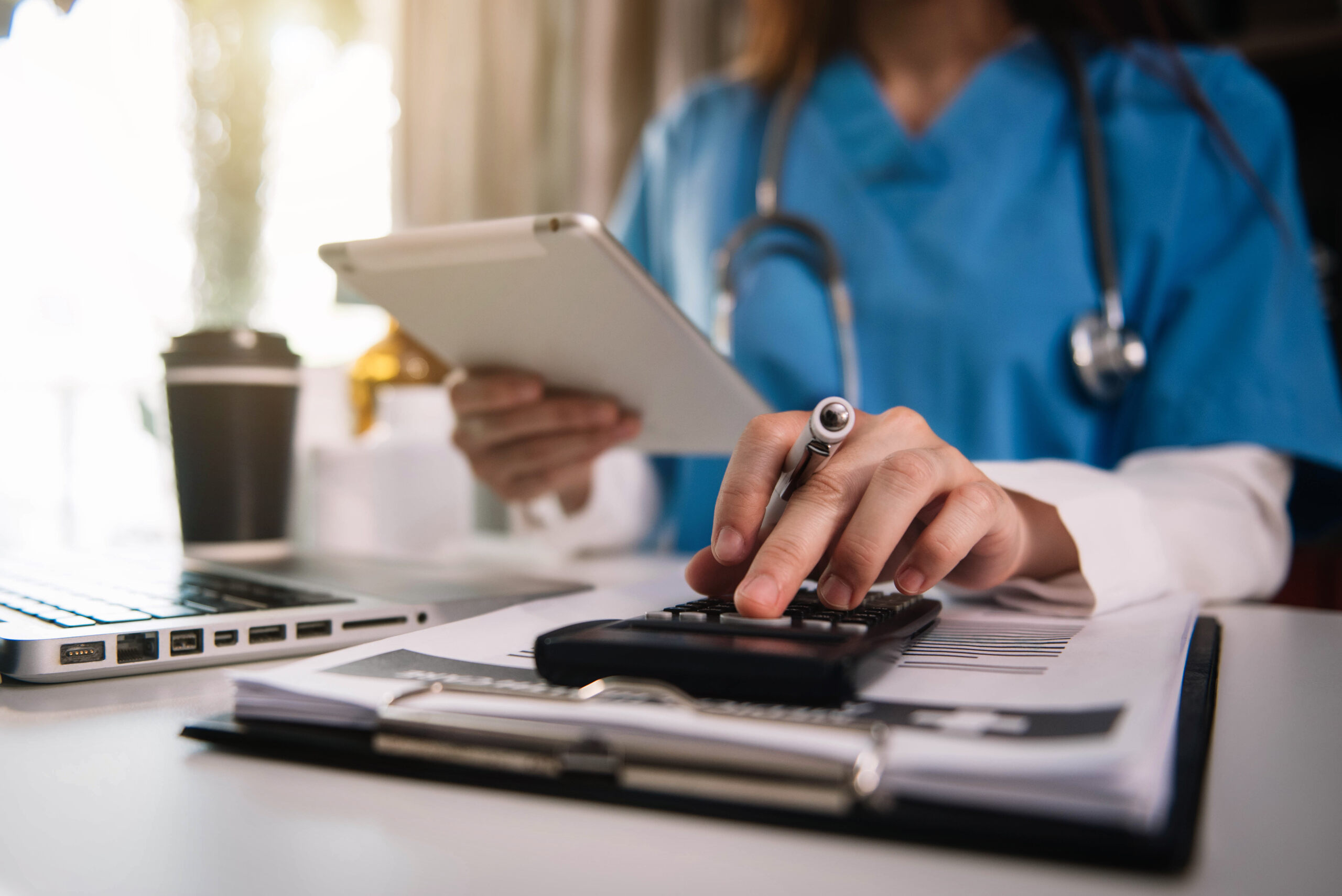 Medical professional reviewing bills and insurance documents after a Florida pedestrian accident involving medical expenses