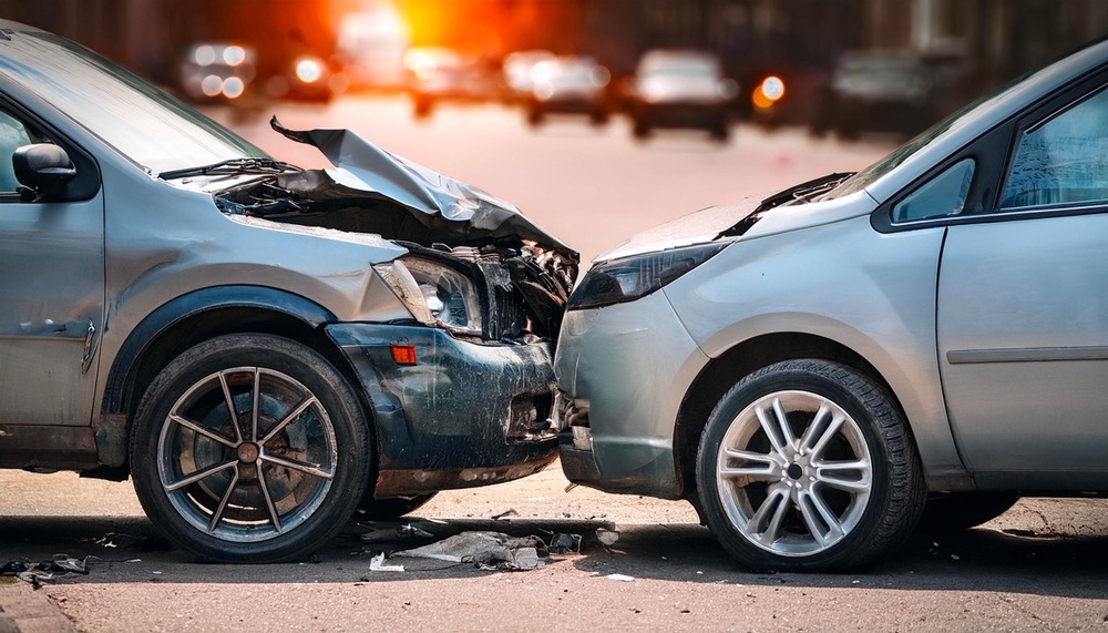 Two cars with severe front end damage after a head on collision in Boca Raton Florida representing the type of car accident cases handled by Frankl Kominsky Injury Lawyers