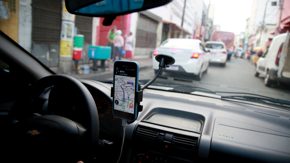 Rideshare navigation app mounted on a car windshield